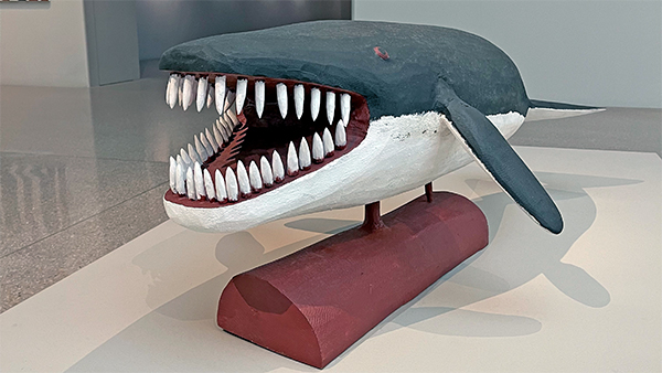 wood carving by Cape York artist Horace Wikmunea titled 'Whale'