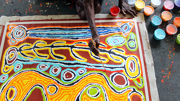 Judy Watson painting at Alice Springs Studio