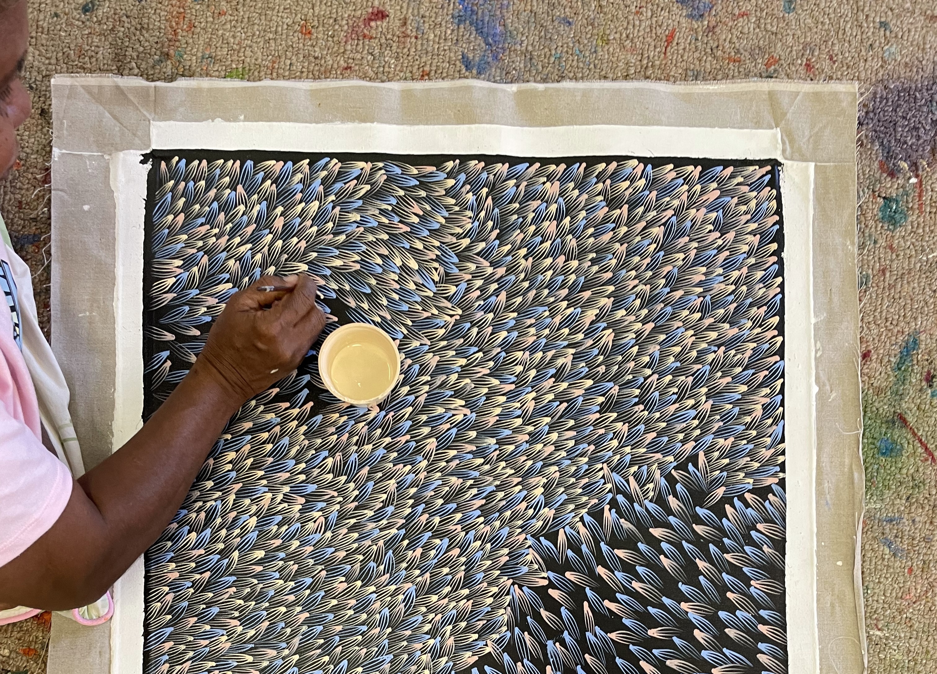 Abie Loy Kemarre painting one of her Bush Medicine artworks