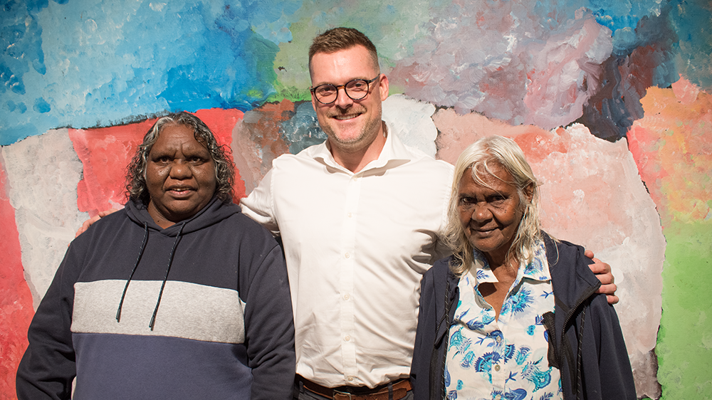 Jack Henderson with Utopia Artists Dulcie Long Pula and Rosemary Petyarre