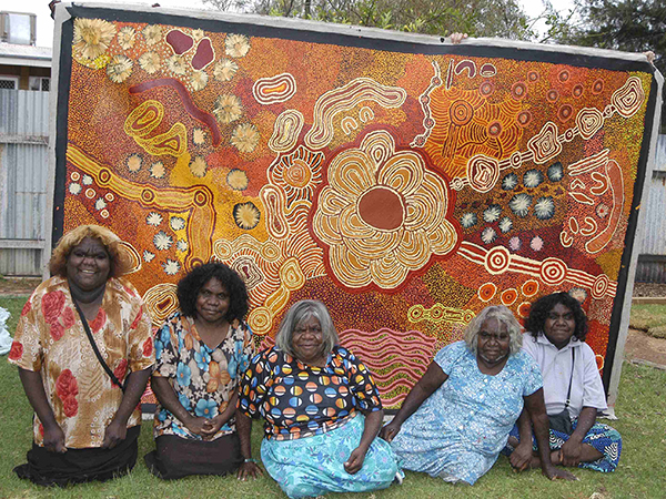 The Baker Family in front of one of their collaborative paintings