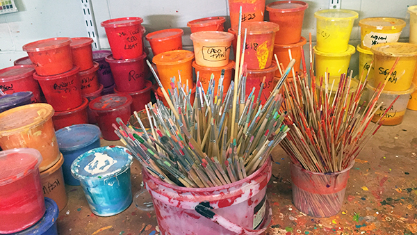 A selection of paints and brushes in the studio