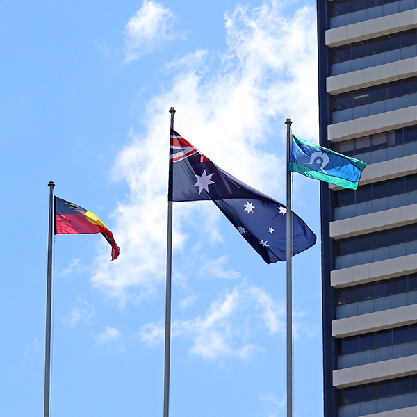 The three flags of Australia flying